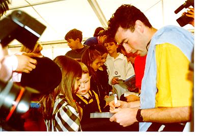 Greg signs a video for a fan